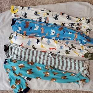 3 pair 2T footie pajamas, and 2 pair 24 month footie pajamas.